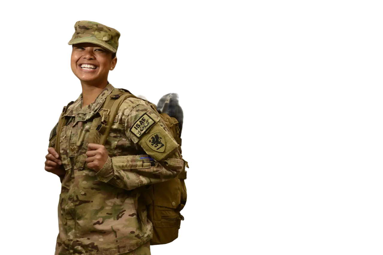 Picture of a smiling veteran with hands behind his back.